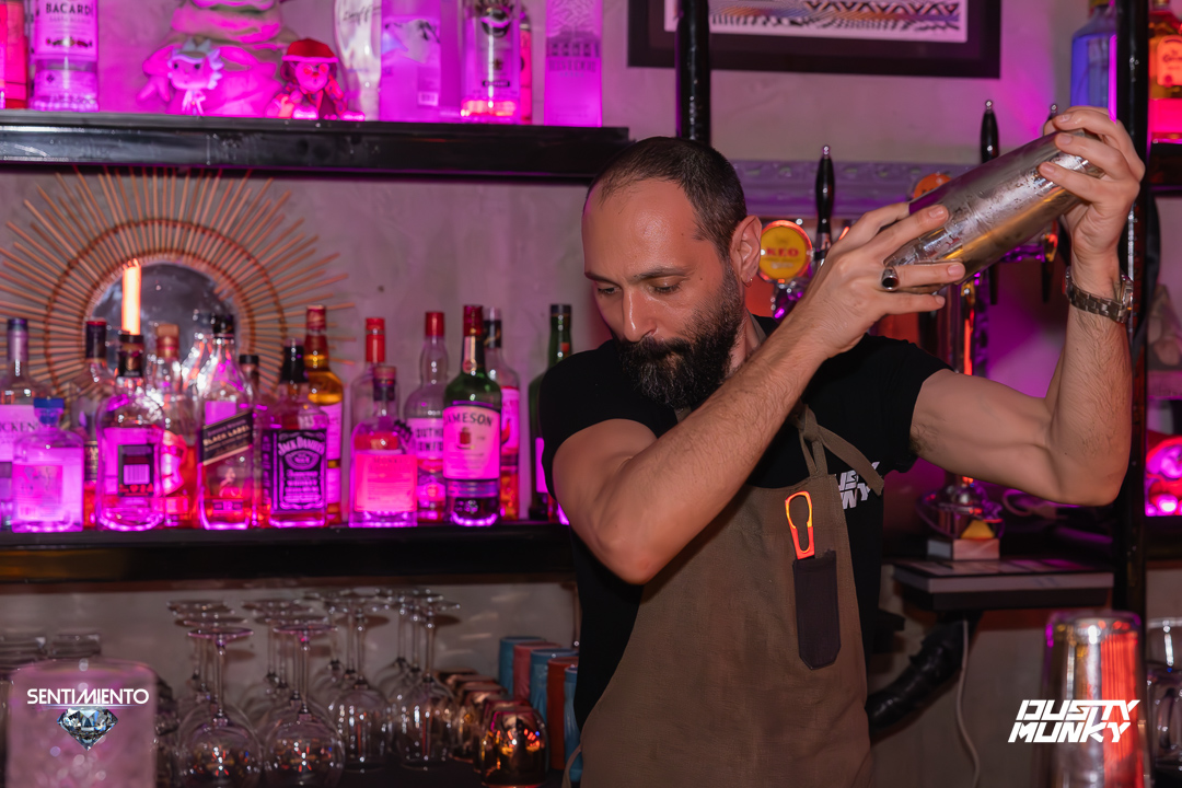 Bartender pouring a fresh shake at the bar